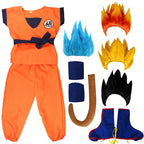 Everything in the Goku kids costume laid out: orange top and trousers, navy sash, two wristbands, tail, blue boot covers and four wig colors