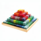 Colorful pyramid made of interlocking wooden blocks on a white background