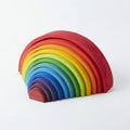 Colorful wooden rainbow toy on a white background