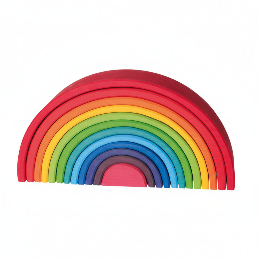 Set of colorful wooden rainbow toys on a white background