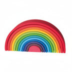 Set of colorful wooden rainbow toys on a white background