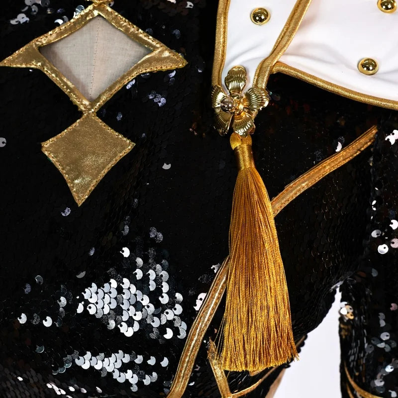 Close-up of the gold tassel, velvet trim and black sequins on the Zoey costume