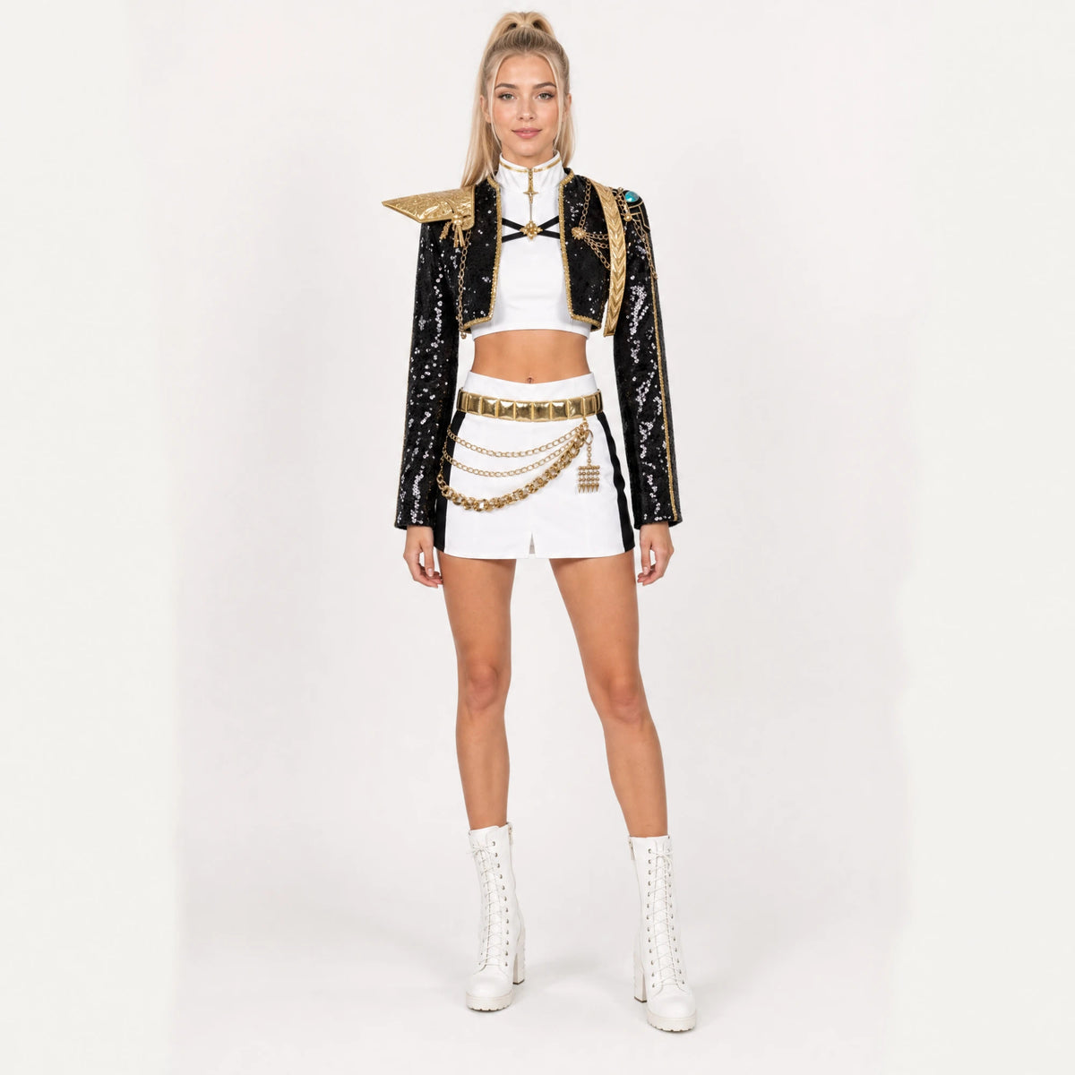 Adult model wearing the Rumi costume: black sequin jacket, gold shoulder armour, white crop top and shorts with belt and waist chains